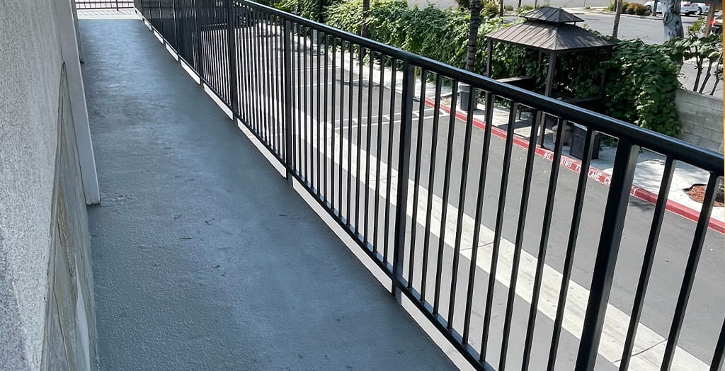 Commercial metal railing system fabricated for exterior walkway and pedestrian safety