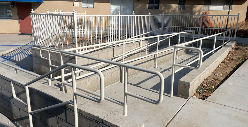 ADA-compliant commercial metal handrails fabricated for accessibility ramp