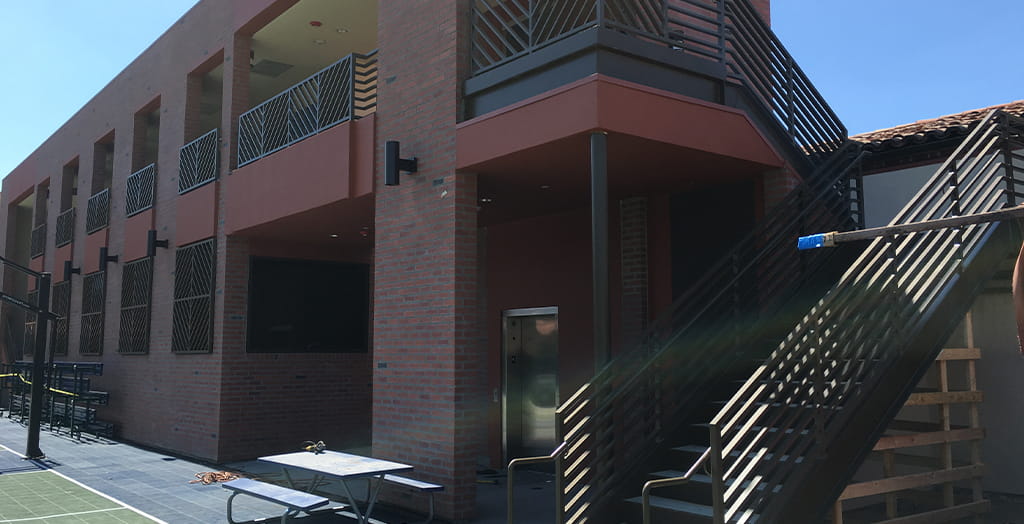 Commercial steel stair and railing fabrication for multi-story building exterior